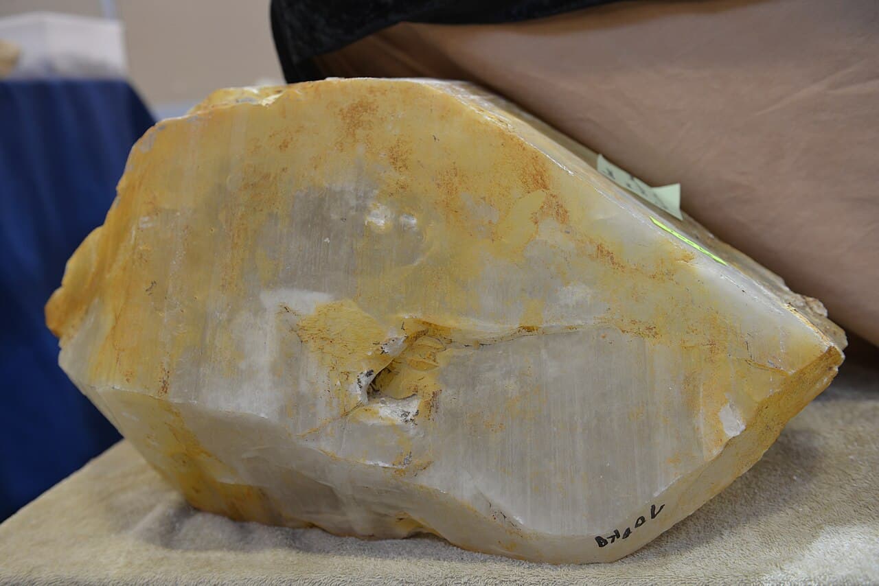 A large colourless prismatic quartz crystal terminated by pyramidal faces.