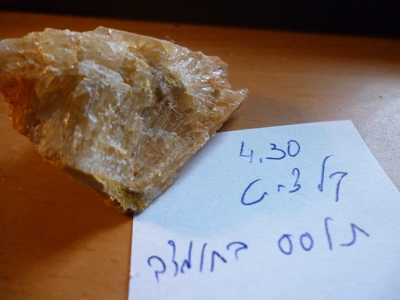 Colourless to pale calcite crystals showing rhombohedral faces.